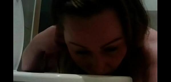  Busty big bbw licking the toilet seat clean after pissing in and on it
